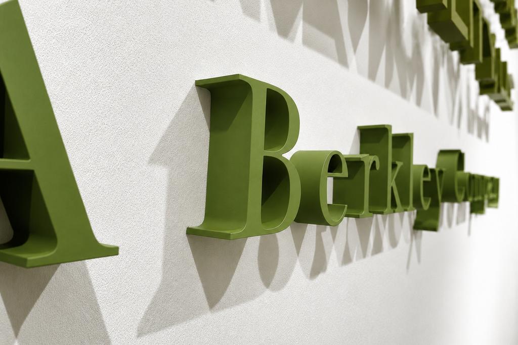 Close-up of custom green dimensional acrylic Berkley office lettering on clear spacers