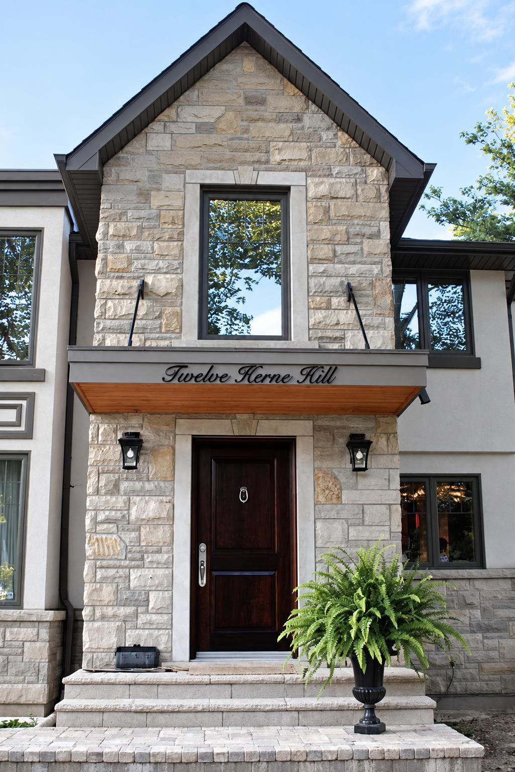 Twelve Herne Hill glossy black acrylic address script above a home entrance