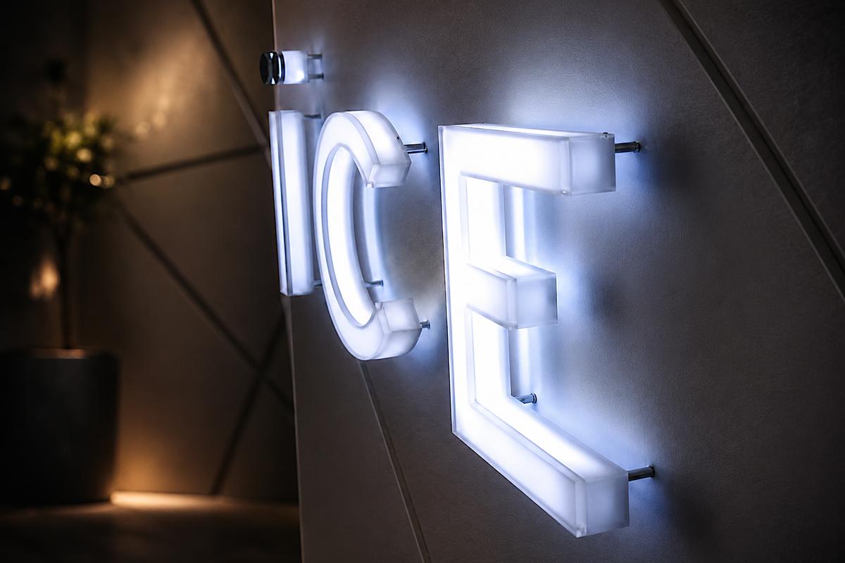 Side view of the ICE Condominiums sign showing 2-inch-deep internally LED-illuminated acrylic letters with glowing faces and returns.