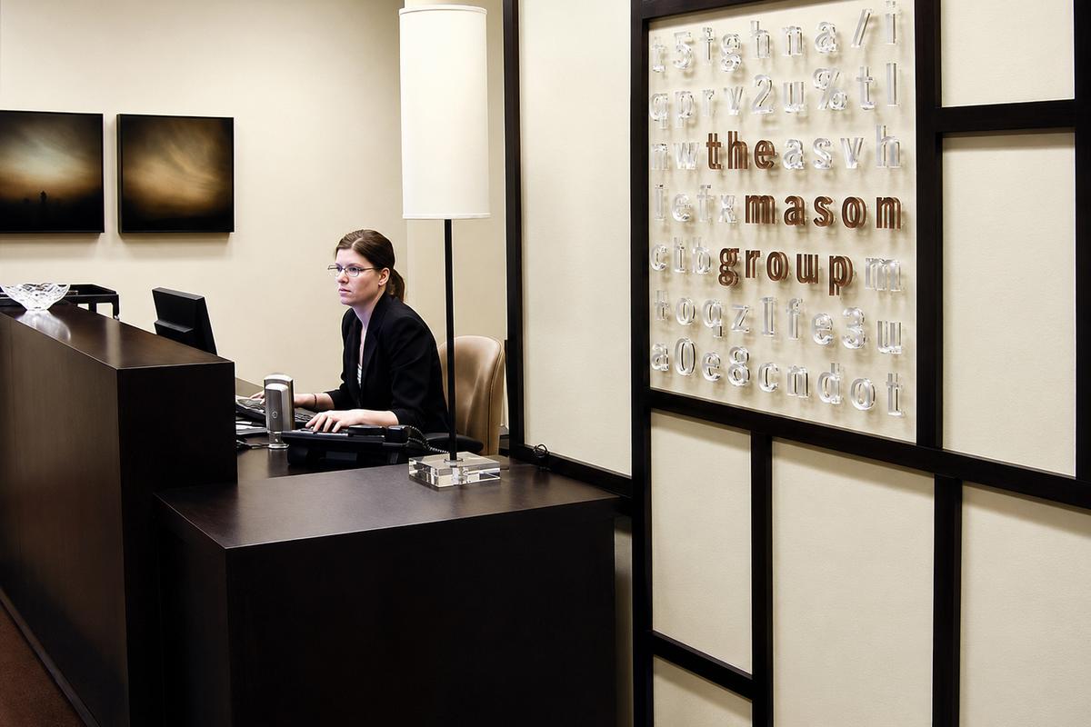 Feature lobby wall sign on interior corporate office building wall with individual raised laser cut acrylic letters - Art Signs Company